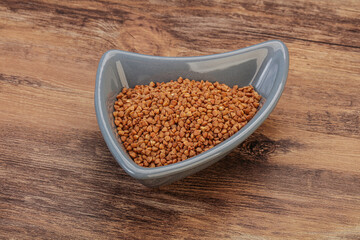 Raw buсkwheat cereal in the bowl