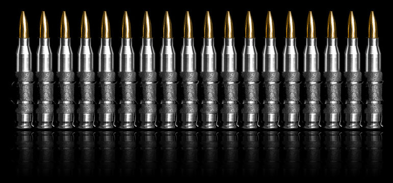 Bullet chain ammunition isolated on black background
