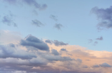 Evening sky with some pink orange and grey clouds