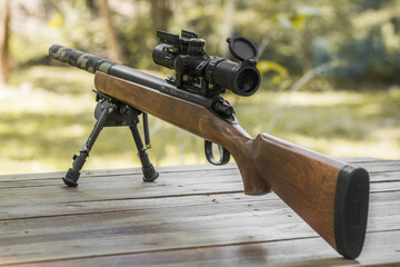 Wooden sniper rifle with scope and bipod - obrazy, fototapety, plakaty