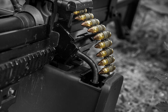 M249 light machine gun with 7.62 mm cartridge belt black and white