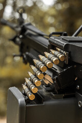 Naklejka premium M249 light machine gun with 7.62 mm cartridge belt black and white