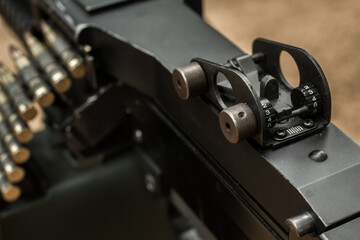 Obraz premium M249 light machine gun with 7.62 mm cartridge belt black and white