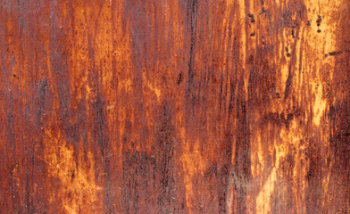 Old rusty background with defects. Multi-layer peeling paint on a metal wall
