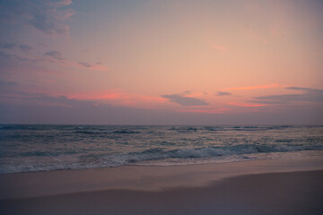 Fototapeta na wymiar Beautiful sunset by the raging ocean. Tinted