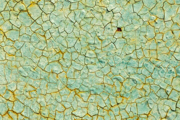 Cracked turquoise paint texture. Old crackled teal turquoise painted wood surface. Green turquoise painted cracked wall texture