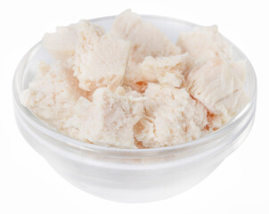 Pieces of boiled chicken breast in bowl isolated on white background