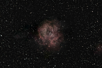 The Rosette Nebula (NGC 2237) is a large emission nebula located in the constellation Monoceros (the Unicorn).  The bright cluster of stars near the centre of the nebula is NGC 2244.