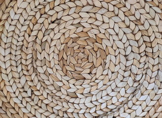 Abstract rattan texture. Background with round large weaving of straw.