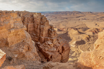 Fototapeta na wymiar Ramon Crater is an erosional crater in the Negev Desert. It is one of five craters in the Negev. At the edge of the crater is the city of Mitspe Ramon.
