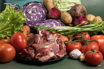 Raw meat and fresh vegetables. Ingredients for soup.