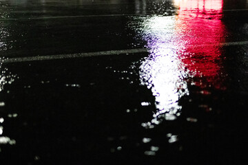 Stormy parking lot with red and white lights