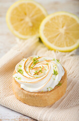 LEMON PIE WITH LEMONS AROUND IT