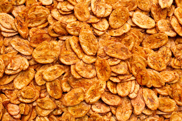 Banana chips background. Top view
