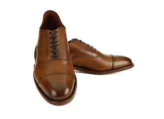Men's brown oxford fashion shoes isolated on a white background.