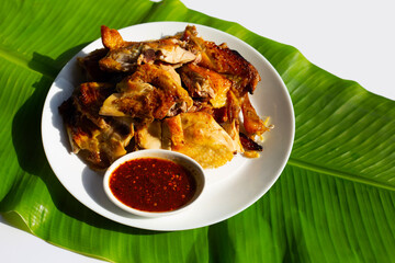 Grilled chicken, Thai style food on banana leaf
