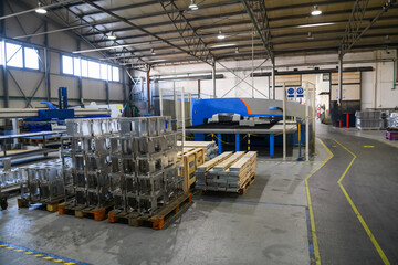 The first phase of metal and aluminum processing. Processed products from CNC machines stacked on a...