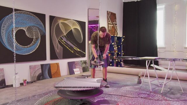 A painter is preparing an equipment for creation a new picture 