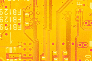 Close up on Electrical pathways in Circuit board, in abstract colors.