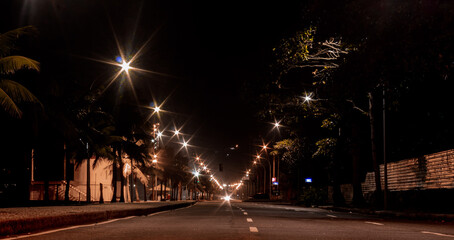 lights on by the sea at night