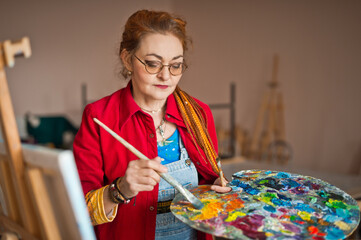 A creative artist at work with a painting 2923.