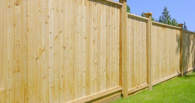 Establishing shot of fence built from wood in Vancouver, Canada, North America. Outdoor landscape. Security and privacy concept. Day time on June 2021. Still camera view. ProRes 422 HQ.