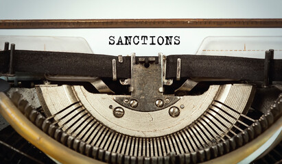 The word sanctions written with a typewriter