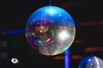 Shining disco ball in a discotheque