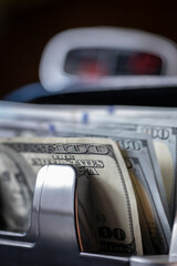 Obraz premium Money counting machine with dollars