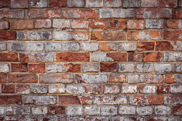 Close up on an old wall made of red bricks