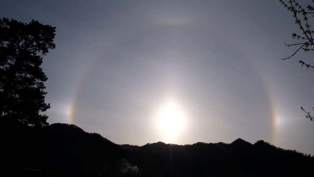  Beautiful Natural phenomenon Sun halo with cloud in the sky in the mountains.