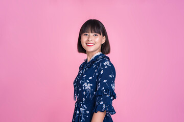 Asian attractive cute short hair woman happy smiling standing laughing joyful confident independent strong mother businesswoman wearing casual dress pink isolated background in studio portrait