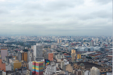 Naklejka na ściany i meble SAO PAULO, BRAZIL - JUNE 11, 2021: Skyline view of Sao Paulo in a cloudy day Including downtown Paulista Avenue buildings famous and historical places