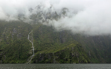 Green cliffs of Milford Sound Palisade Falls - New Zealand
