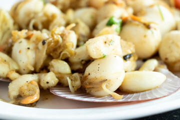 Grilled scallop cook with garlic background