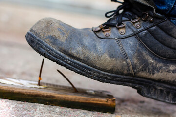 Wear safety shoes to ensure safety at work. construction workers wear safety shoes. People with...