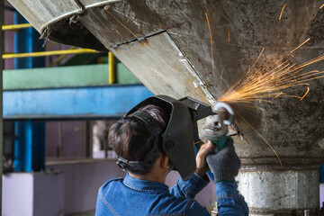 Grinding stainless tank repair silo © chitsanupong
