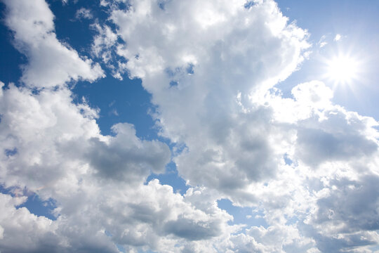 Sun shining though cumuls clouds