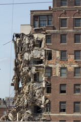 Decaying Brick Building Being Demolished on City Street