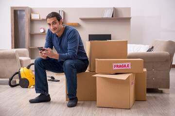 Young man moving to new flat