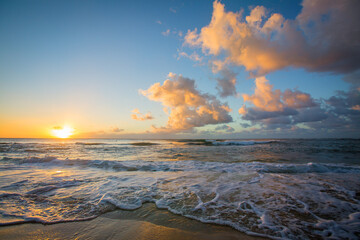 Sunset on Pink Clouds over Ocean Waves