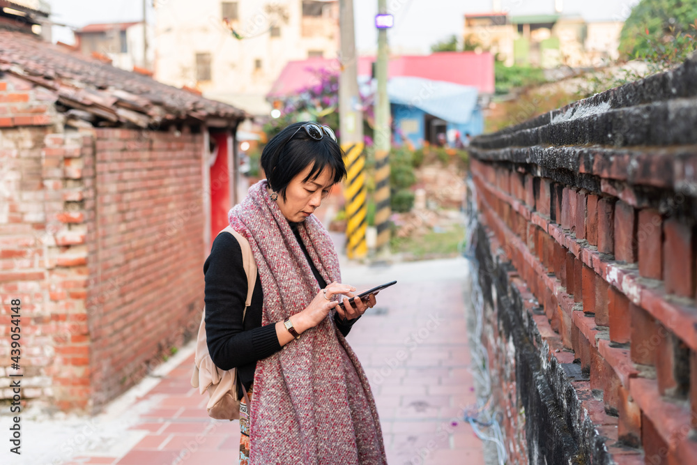 Canvas Prints traveling asian woman using cellphone