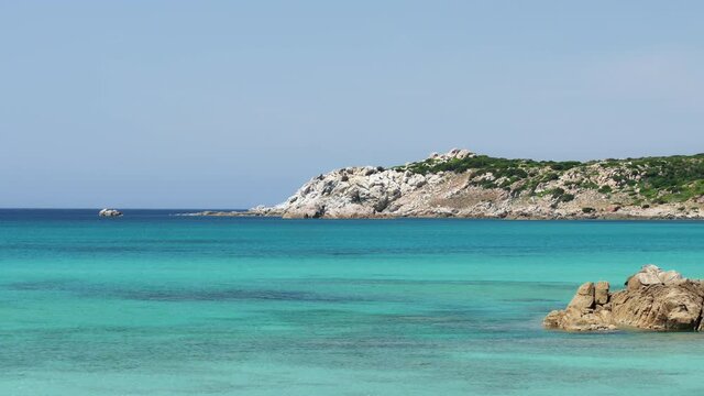Stunning view of a coastline bathed by a turquoise, clear sea. Rena Majore is a small seaside village that's located south of Santa Teresa Gallura, Sardinia, Italy.