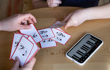 Close-up of cards for studying music and piano in the phone.