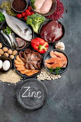 Food high in zinc on dark background. Healthy eating concept.