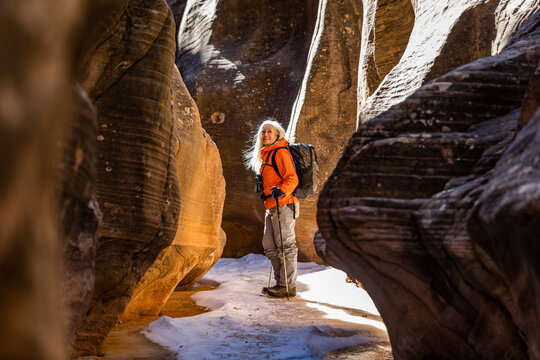 USA, Utah, Escalante, Woman hiking in slot canyon in Grand Staircase-Escalante National Monument