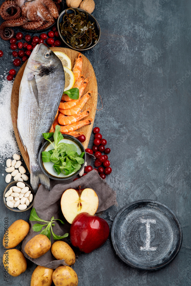 Wall mural Food high in iodine on dark gray background. Healthy eating concept.