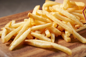 french fries on a wooden background