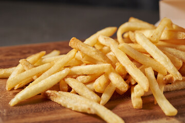 french fries on a wooden background