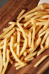 french fries on a wooden background